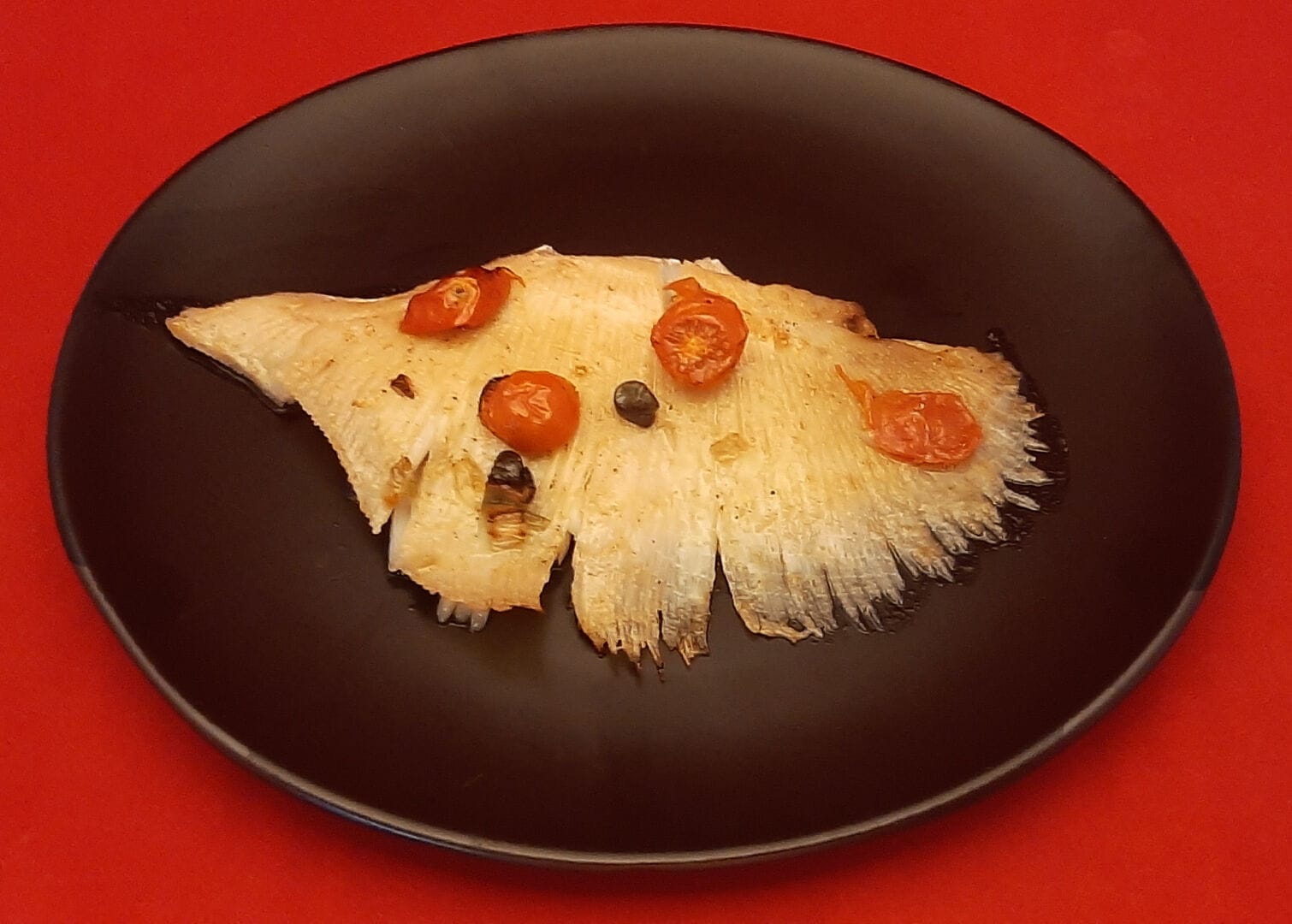 Ailes de raie aux câpres. Une cuisson de poisson de mer au four
